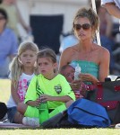 Denise Richards takes her baby daughter Eloise to the park with older daughters Lola and Sam to watch Sam play soccer