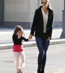 Katie Holmes and daughter Suri Cruise make their way out of their Pittsburgh, Pennsylvania hotel on October 6, 2011.