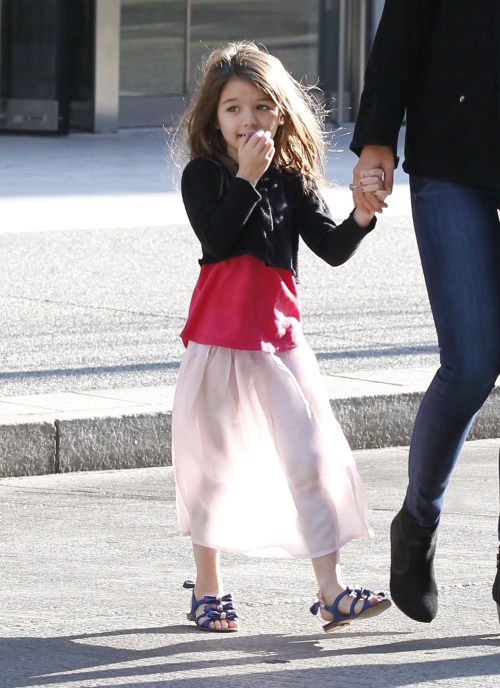 Katie Holmes and daughter Suri Cruise make their way out of their Pittsburgh, Pennsylvania hotel on October 6, 2011.