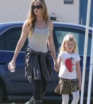 Denise Richards cheers on her daughter Lola during her soccer game while on the sidelines with her other daughter Sam
