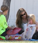 Denise Richards cheers on her daughter Lola during her soccer game while on the sidelines with her other daughter Sam