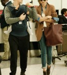 Miranda Kerr and Orlando Bloom with Son Flynn at Heathrow International Airport in London, England (October 12).