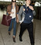 Miranda Kerr and Orlando Bloom with Son Flynn at Heathrow International Airport in London, England (October 12).