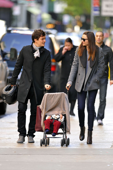 Orlando Bloom and Miranda Kerr show off their baby son Flynn while out and about in NYC