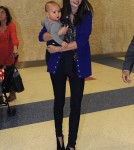 Miranda Kerr and Flynn arrive at JFK Airport in New York City on Sunday (October 16).
