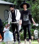 Katherine Heigl wears a witch costume as she and her husband Josh Kelley dress their adorable daughter Naleigh in a princess costume for a Halloween party.