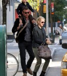 Naomi Watts walks with Liev Schreiber, who carried their son Sasha on his shoulders, before hailing a taxi in Tribeca.