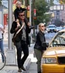 Naomi Watts walks with Liev Schreiber, who carried their son Sasha on his shoulders, before hailing a taxi in Tribeca.