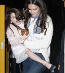 Suri Cruise Makes Faces at the Paparazzi As Mom Katie Holmes Holds Her