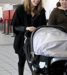 Jessica Alba was chic in all black as she arrived at the airport with her new daughter Haven in Los Angeles, California on November 5th, 2011.