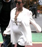 Pregnant Beyonce Knowles leaves an office building in Manhattan. under wraps as she leaves an office building in Manhattan.