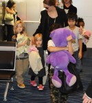 Brad Pitt and Angelina Jolie at the Haneda International Airport in Tokyo with their 6 children (November 10).