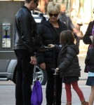 Hugh Jackman enjoys an apple while waiting for his wife, Australian actor Deborah-Lee Furness, and their daughter Ava in New York, New York on November 2, 2011.