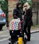 Kate Hudson and Matthew Bellamy wrap up warm as they stroll with their baby son, Bingham Hawn Bellamy, in London.