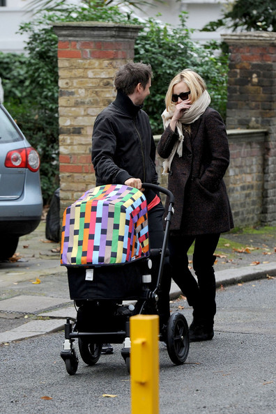 Kate Hudson and Matthew Bellamy wrap up warm as they stroll with their baby son, Bingham Hawn Bellamy, in London.
