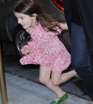 Suri Cruise runs past photographers on her way home as mom, Katie Holmes strides in at a more normal speed on November 7, 2011 in new York City, New York.