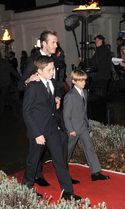 David Beckham with sons Romeo Beckham and Brooklyn Beckham attending The Sun Military Awards at Imperial War Museum in London