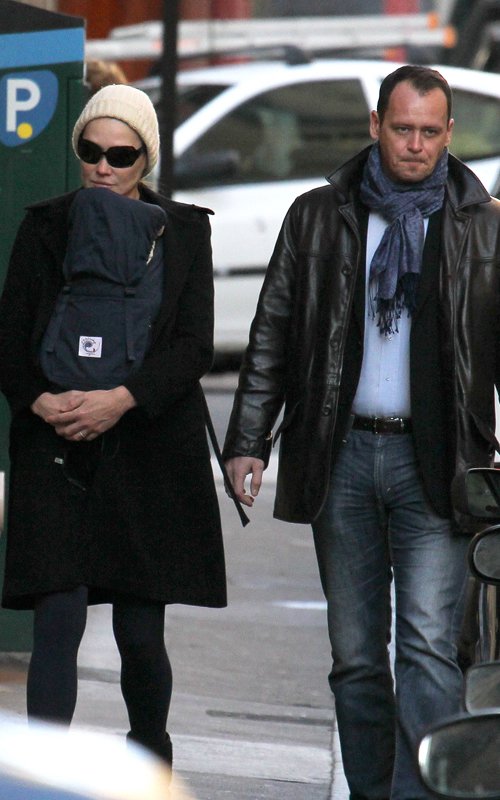 Carla Bruni-Sarkozy taking a stroll around Paris with her baby (December 6).