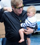 Elton John holds his son Zachary Jackson Levon Furnish-John before boarding a yacht in the Sydney Harbour for a party
