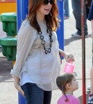 BABY BUMP ALERT! Alyson Hannigan, who is currently pregnant with her second child, takes her daughter Satyana to play at the park with husband Alexis Denisof