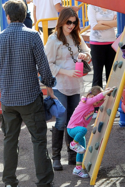 BABY BUMP ALERT! Alyson Hannigan, who is currently pregnant with her second child, takes her daughter Satyana to play at the park with husband Alexis Denisof