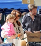 BABY BUMP ALERT! Alyson Hannigan, who is currently pregnant with her second child, takes her daughter Satyana to play at the park with husband Alexis Denisof