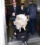 Elizabeth Banks and husband Max Handelman touch down at LAX in Los Angeles, CA with baby Felix Handelman on January 22, 2012