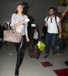 Alessandra Ambrosio, husband Jamie Mazur and daughter Anja arriving for a flight at LAX airport in Los Angeles, CA on February 3, 2012.
