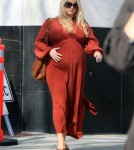 A very Pregnant Jessica Simpson was out and about shopping in the Beverly Hills area of California on February 25, 2012 wearing a long dress with a pair of very high heels. She and her assistant stopped by Saks Fifth Avenue for a few items before heading on their way.