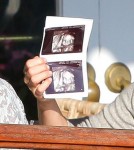 Pregnant actress Molly Sims showing off her sonogram pictures to friends while out for lunch at Cafe Med in West Hollywood, CA on February 19, 2012