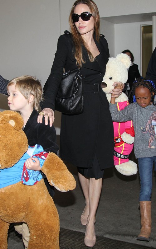 Angelina Jolie arriving on a flight from Amsterdam at LAX Airport with her daughters Shiloh and Zahara (March 15)