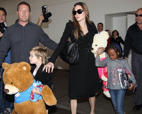 Angelina Jolie arriving on a flight from Amsterdam at LAX Airport with her daughters Shiloh and Zahara (March 15)