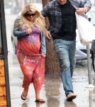 Jessica Simpson and Eric Johnson braving the rain in Palm Springs March 25