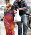 Jessica Simpson and Eric Johnson braving the rain in Palm Springs March 25