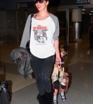 "Resident Evil" actress Milla Jovovich arrived at JFK Airport in New York on May 6, 2012. The actress had her daughter Ever Anderson riding along on her luggage.