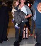 "Resident Evil" actress Milla Jovovich arrived at JFK Airport in New York on May 6, 2012. The actress had her daughter Ever Anderson riding along on her luggage.