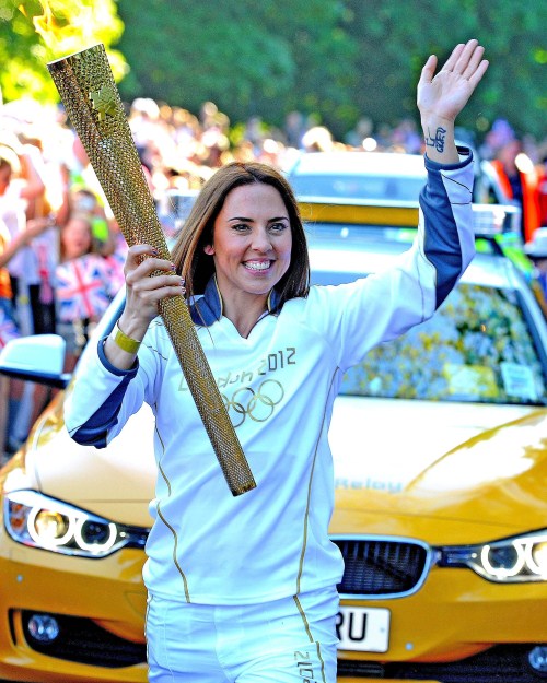 ormer "Spice Girl" Melanie Chisholm, Mel C, starts her run with the Olympic Torch in Liverpool, England on June 1, 2012..
