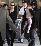 Nicole Richie and her husband Joel Madden arriving with their kids at LAX - June 19