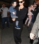 Nicole Richie and her husband Joel Madden arriving with their kids at LAX - June 19