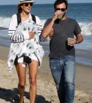 Model Alessandra Ambrosio enjoyed a stroll down the beach in Malibu, California on July 14, 2012 with her newborn son Noah and her long-term fiance Jamie Mazur.