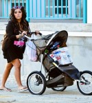 Snooki pushing a stroller full of beer and soda in Seaside Heights (July 2).