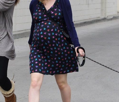 Expecting “True Blood” actress Anna Paquin enjoyed a stroll with her dog and a pal in Venice, California on August 24, 2012. She was wearing a dark blue dress that showed off her growing baby bump. `