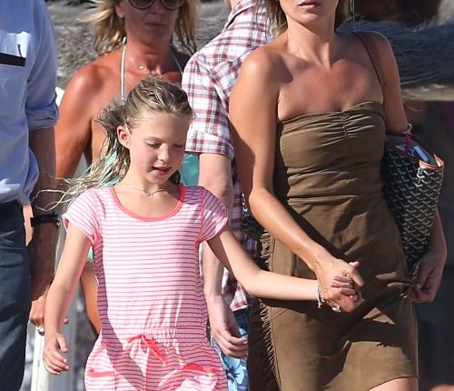 Model Kate Moss and her daughter Lila take a walk on the beach while vacationing in Saint-Tropez, France on August 16, 2012.