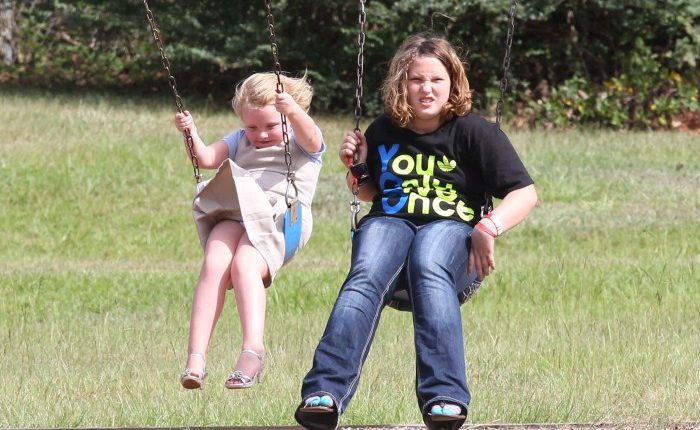 Reality TV star Alana Thompson aka ‘Honey Boo Boo’ wears heels while swinging at the with her sisters Jessica