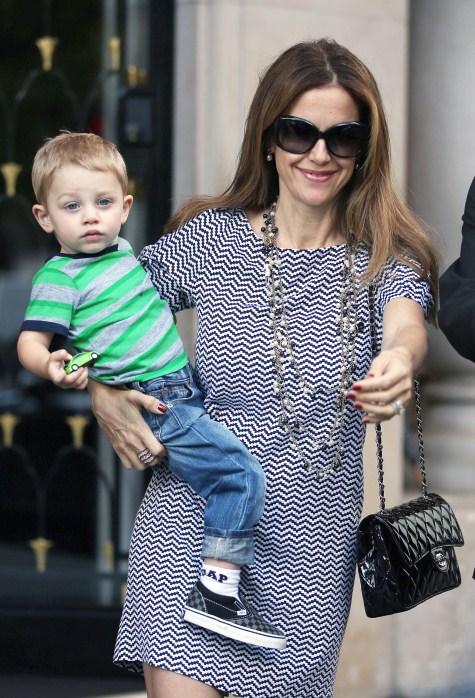 John Travolta and his wife Kelly Preston enjoy lunch with their son Benjamin at Pizza Pino on September 12, 2012 in Paris, France