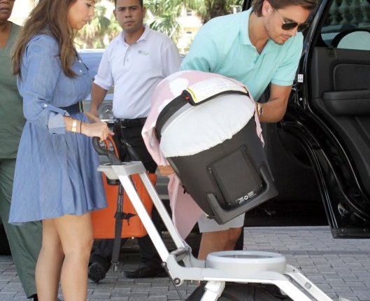 “Keeping Up with the Kardashians” star Kourtney Kardashian and her partner Scott Disick return to their hotel with daughter Penelope in Miami, Florida on October 5, 2012.