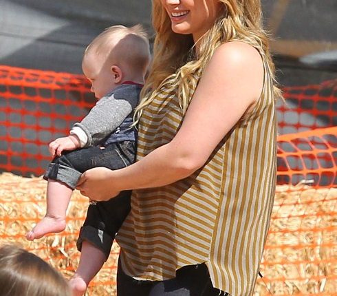 Actress Hilary Duff and husband Mike Comrie take their son Luca to the Mr. Bones Pumpkin Patch in West Hollywood, California on October 13, 2012.