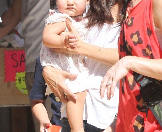 Roselyn Sanchez and husband Eric Winter take their daughter Sebella to the Mr. Bones Pumpkin Patch in West Hollywood, California on October 14, 2012.