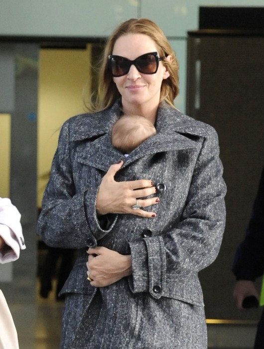Uma Thurman and Rosalind Luna arrive at Heathrow Airport from Los Angeles on October 17, 2012 in London, England.