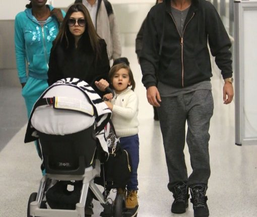 Kourtney Kardashian And Family Arriving On A Flight At LAX